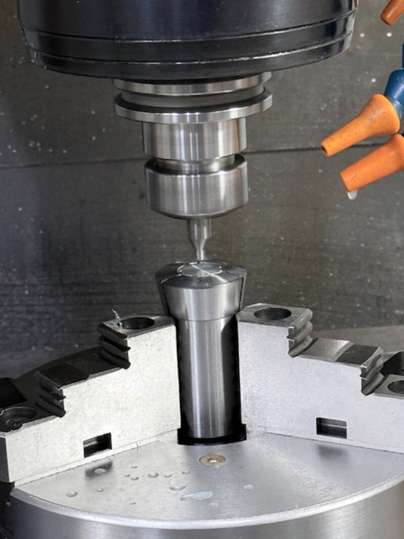 CNC mill drilling into a part